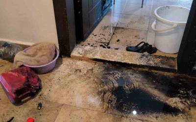Tartıştığı eski kız arkadaşının daire kapısını benzinle ateşe verdi
